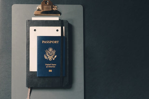 An American passport attached to a notebook