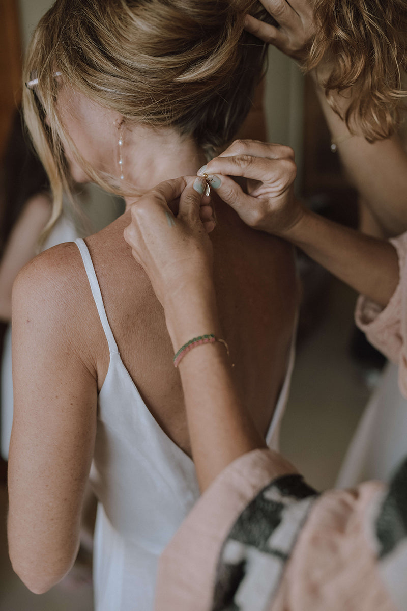 Detail from Amy Segal's petite wedding dress and a wedding ceremony in Tulum