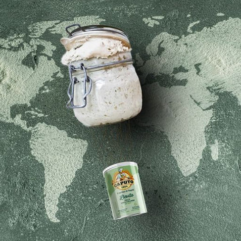 A top view of a can of caputo yeast and a glass jar with dough overflowing from it sitting on a green world map