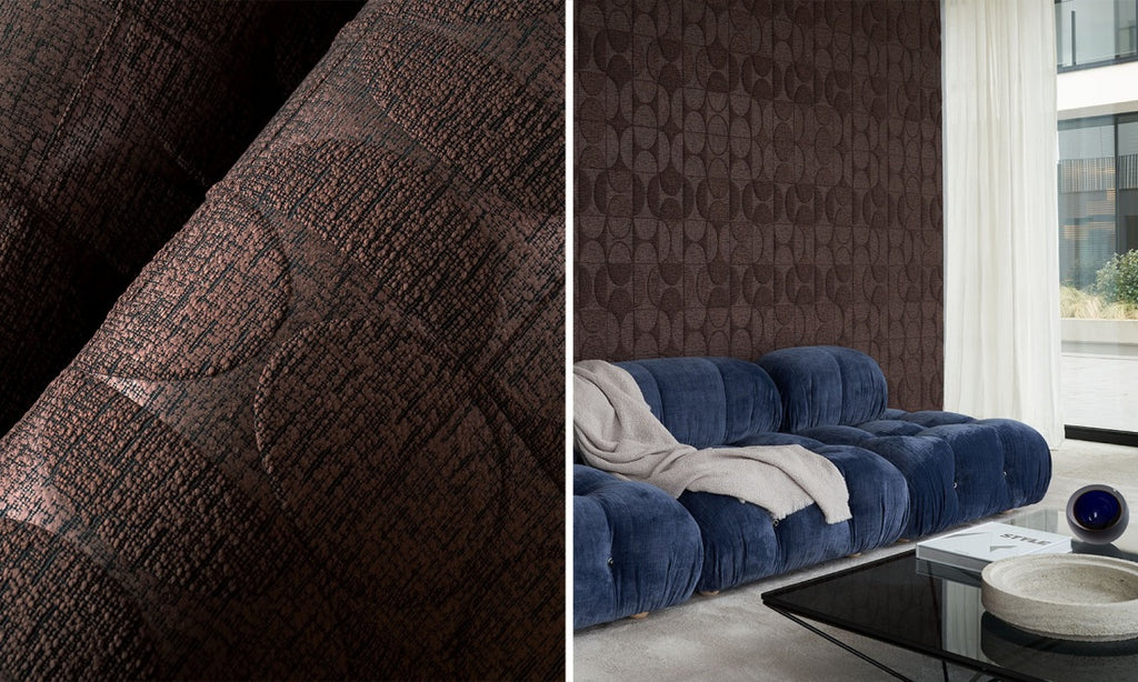 brown textured wallpaper , blue velvet sofa in front