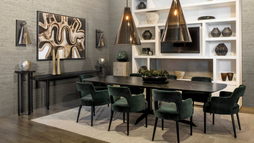 black table in the middle of the room, white book shelf behind, chairs and frames on walls