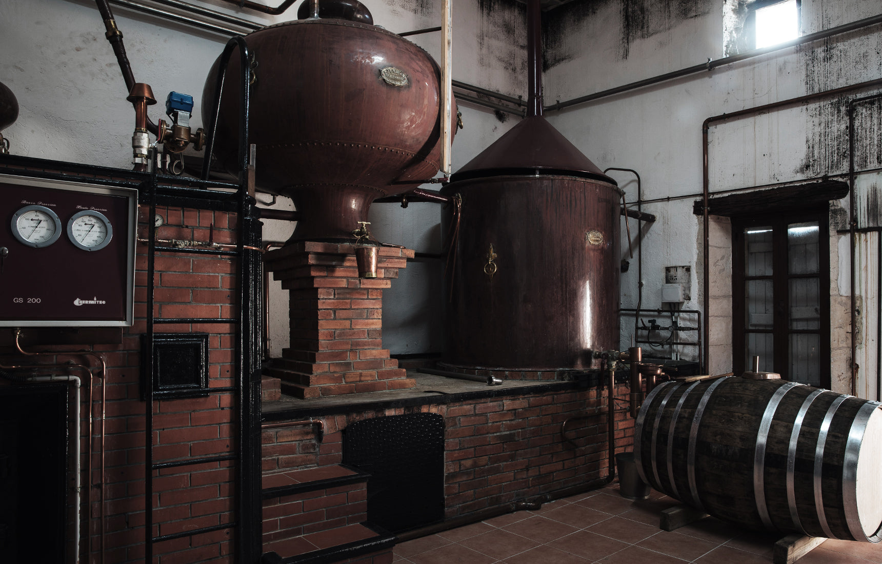 The Cognac is made in traditional alembic copper pot stills. Copper is a great conductor and disperser of heat. It also cancels out any sulphuric flavour that would cause bitterness in the spirit. Photo by Cognac Lhéraud.