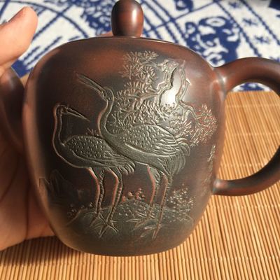 Nixing teapot with carvings by Li Changquan