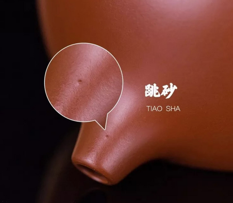 Tiny holes or "jumping sand" 跳砂 on the surface of an Yixing teapot.