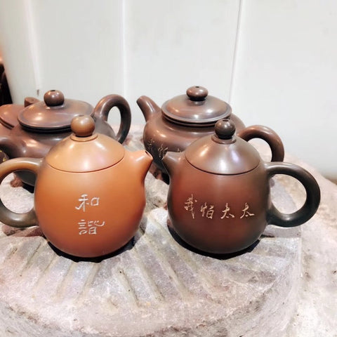 Nixing Teapots displaying their characteristic yaobian.