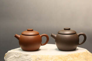 Zhuni teapot on the left, and TianQingNi (Zini) Teapot 