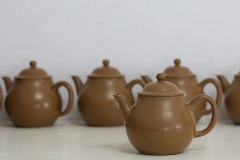 Zhuni Teapots ready for the kiln! Zhuni clay turns from yellow to red when fired.