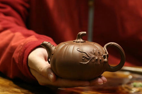 A fully Handmade Yixing Teapot shaped like a pumpkin