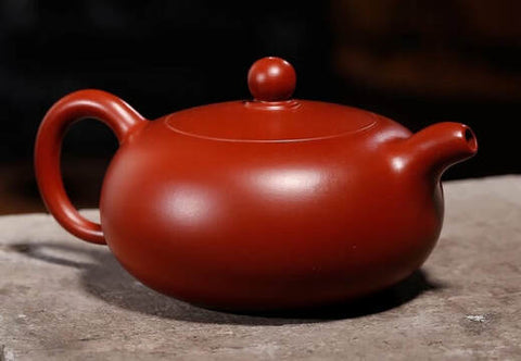 Mass-market "dahongpao" teapot. Notice the bright red greasy surface.