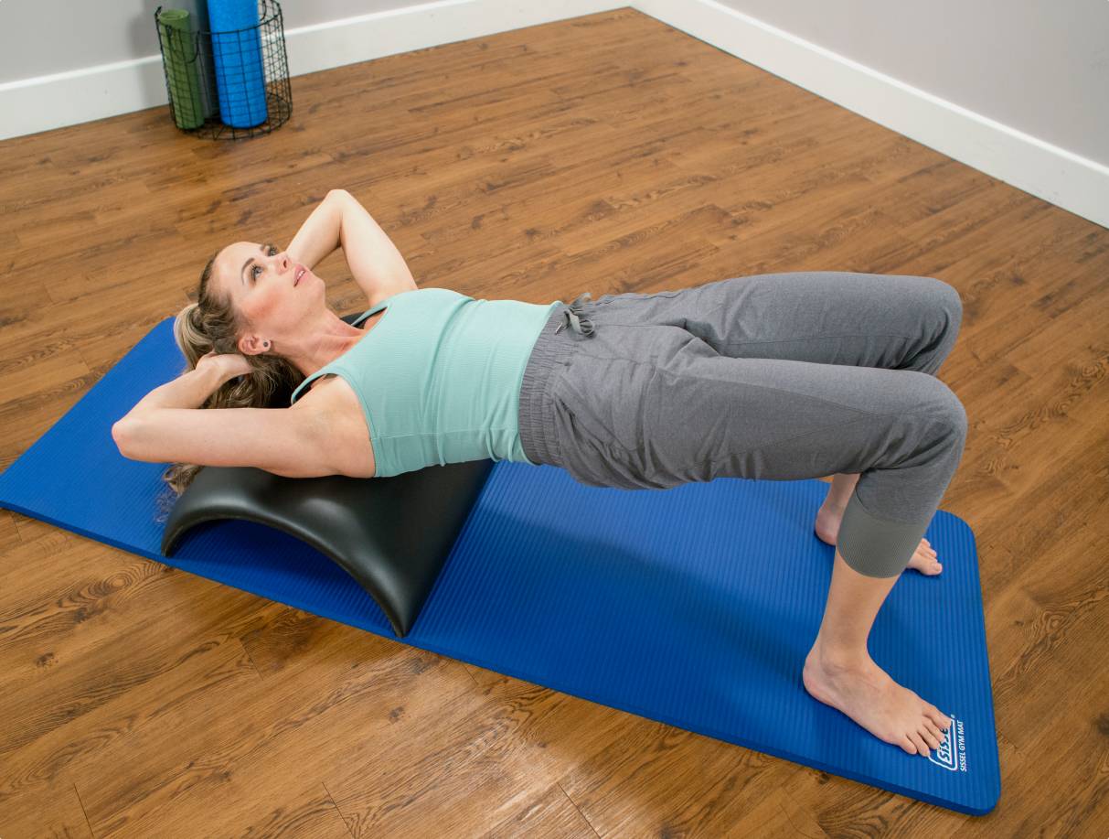 Woman performing laid-back exercise on Baby Arc West Coast style.