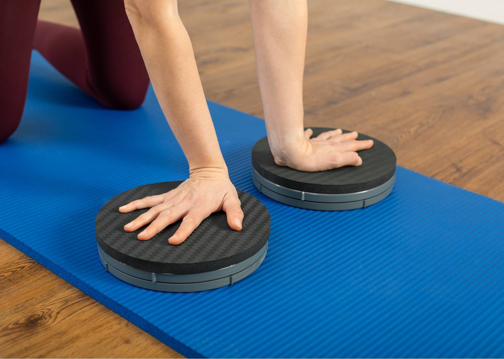 Woman using a rotator disc pad.