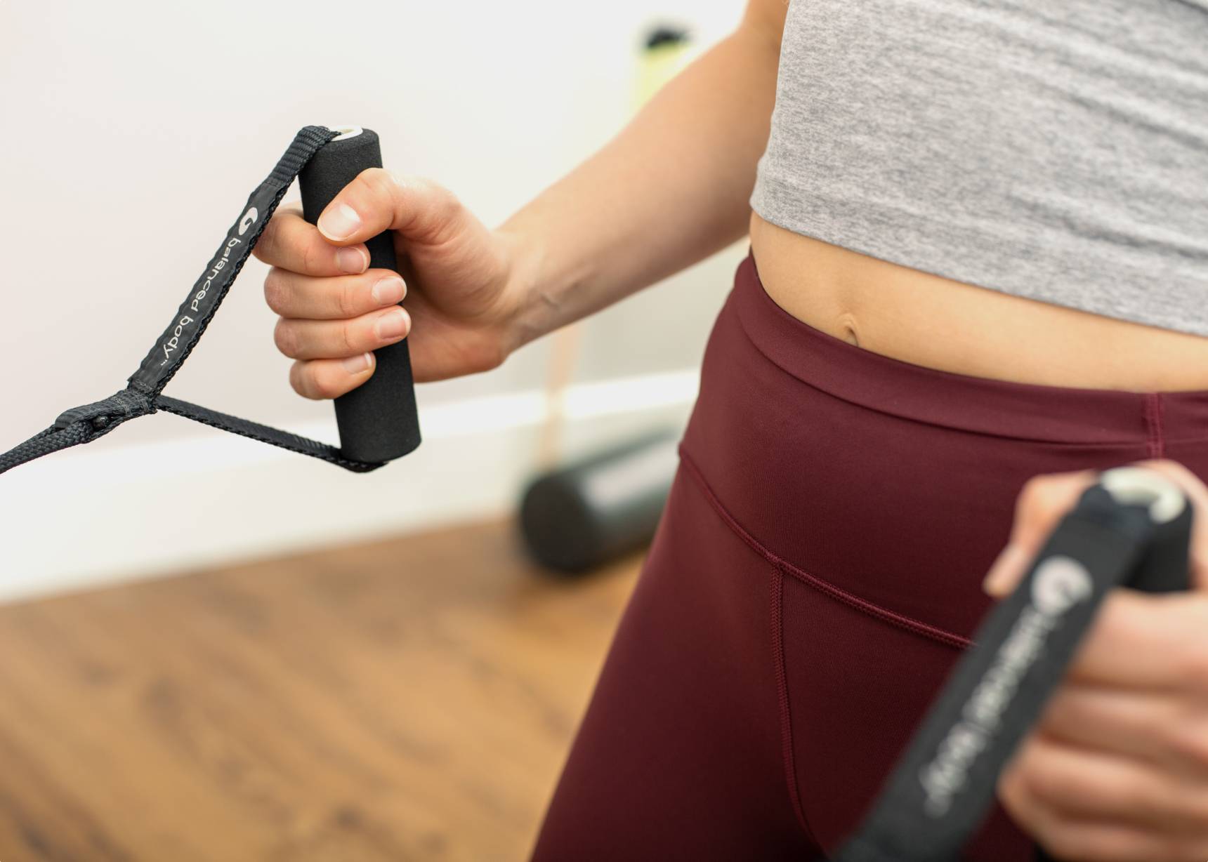 Woman holding two SoftTouch Polypro Handles.