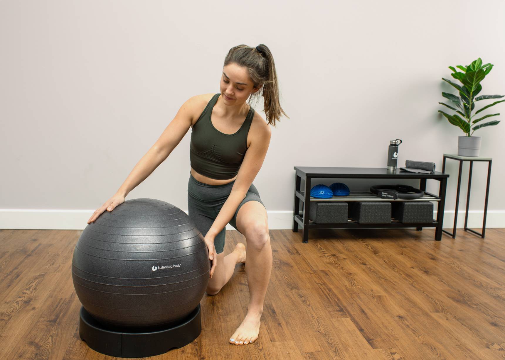 Woman holding a Deluxe Fitness Ball