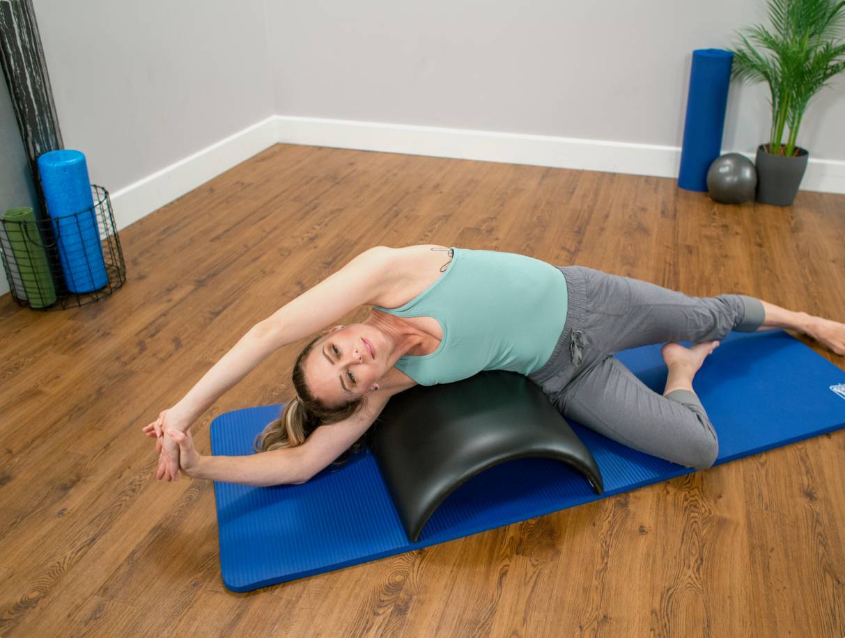 How to Do Lower and Lift Prone on the Pilates Arc Barrel - Custom Pilates  and Yoga