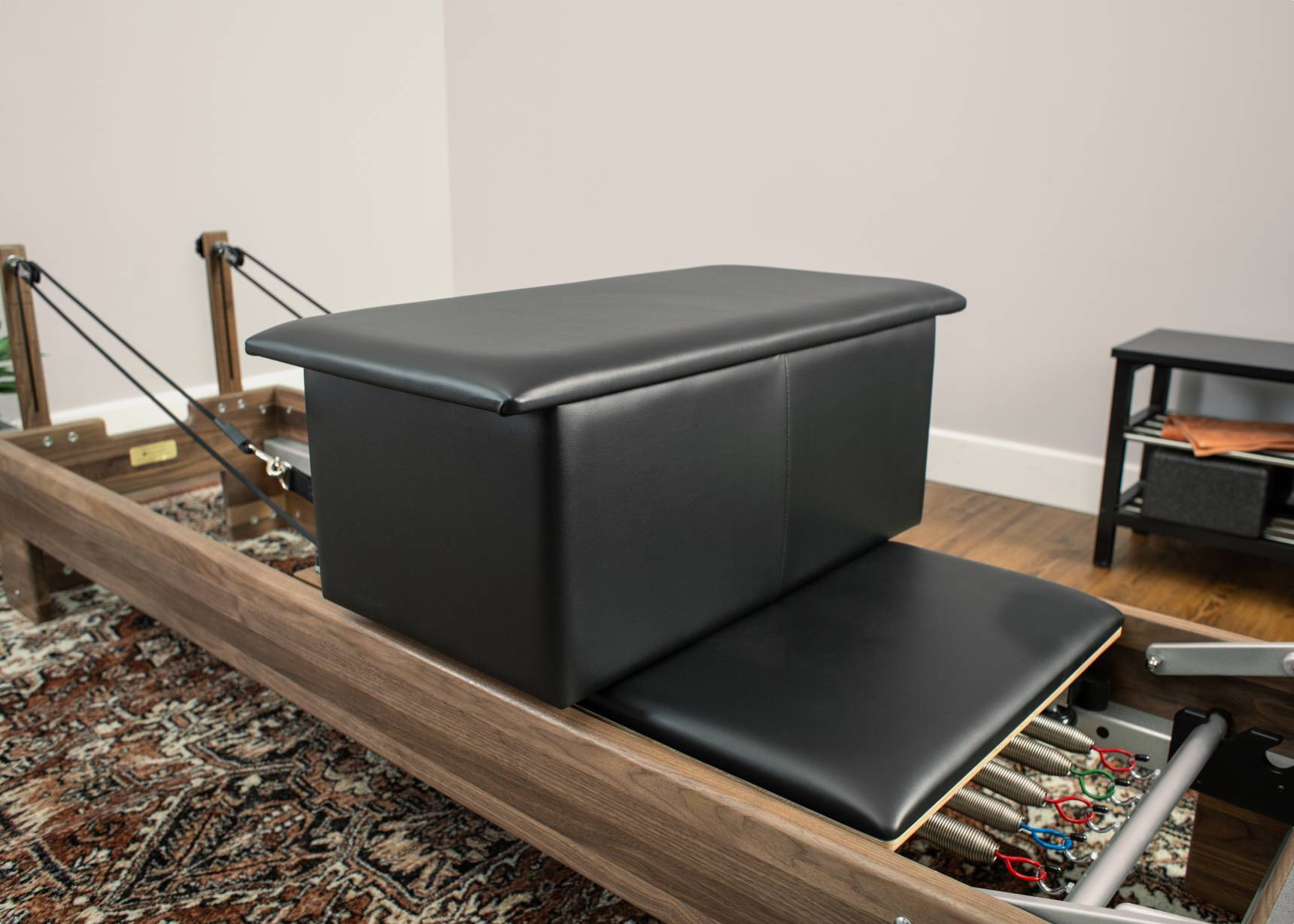 The large sitting box can be used alone or with other Pilates equipment to enhance your practice