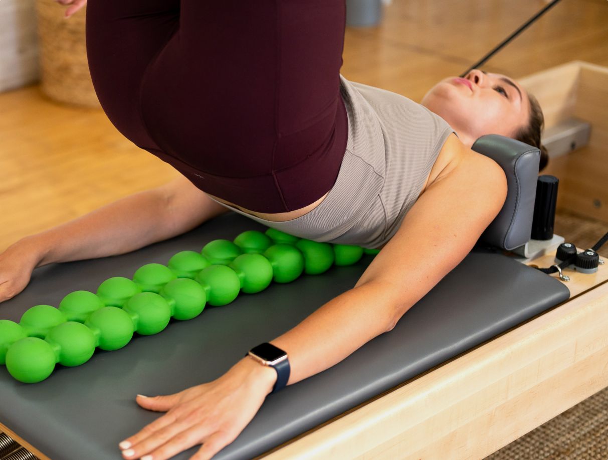 Woman using Back Stretcher Device Sissel Spinefitter