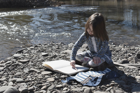 pencil roll with girl coloring outside