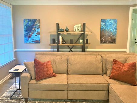 Two metal paintings hanging as living room decoration
