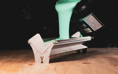 baselayr complete emulsion being poured into a scoop coater