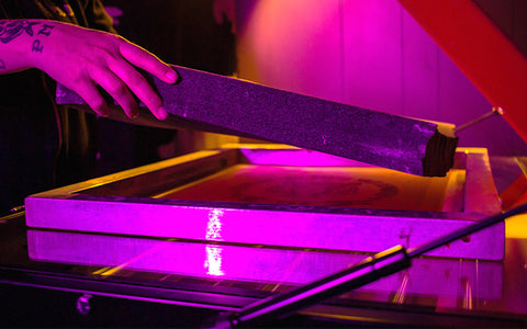 person placing foam on a screen 