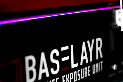 a close up of the baselayr logo on an exposure unit