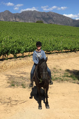 Dorene Lorenz on Frisian horse at Diemersfontein Winery