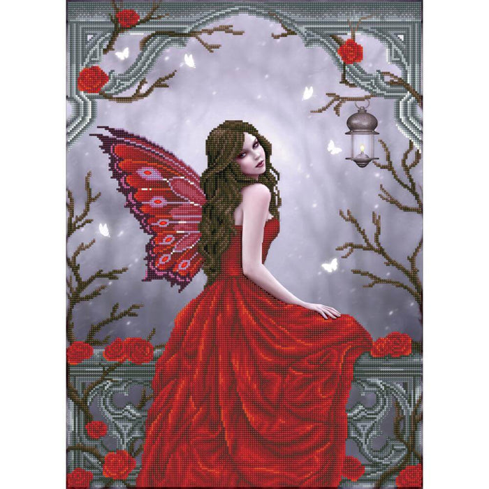 A fairy in red with crimson wings sits on a ledge surrounded by roses and white butterflies. The finished product of a diamond painting kit