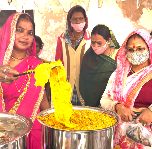 women dyeing with Marigold temple waste