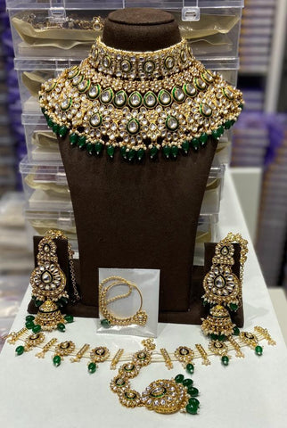 Emerald Green Kundan Bridal Set: Stunning Copper-Based Jewelry with Linear Drop Design