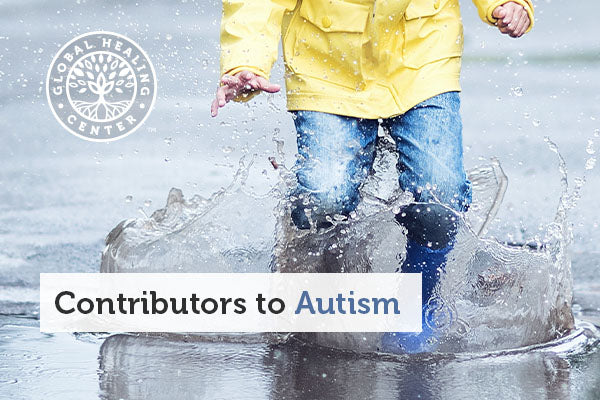 A little boy playing in rain puddles.