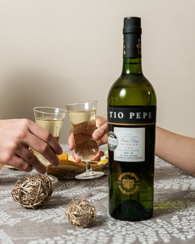 Tio Pepe sherry wine bottle and two glasses