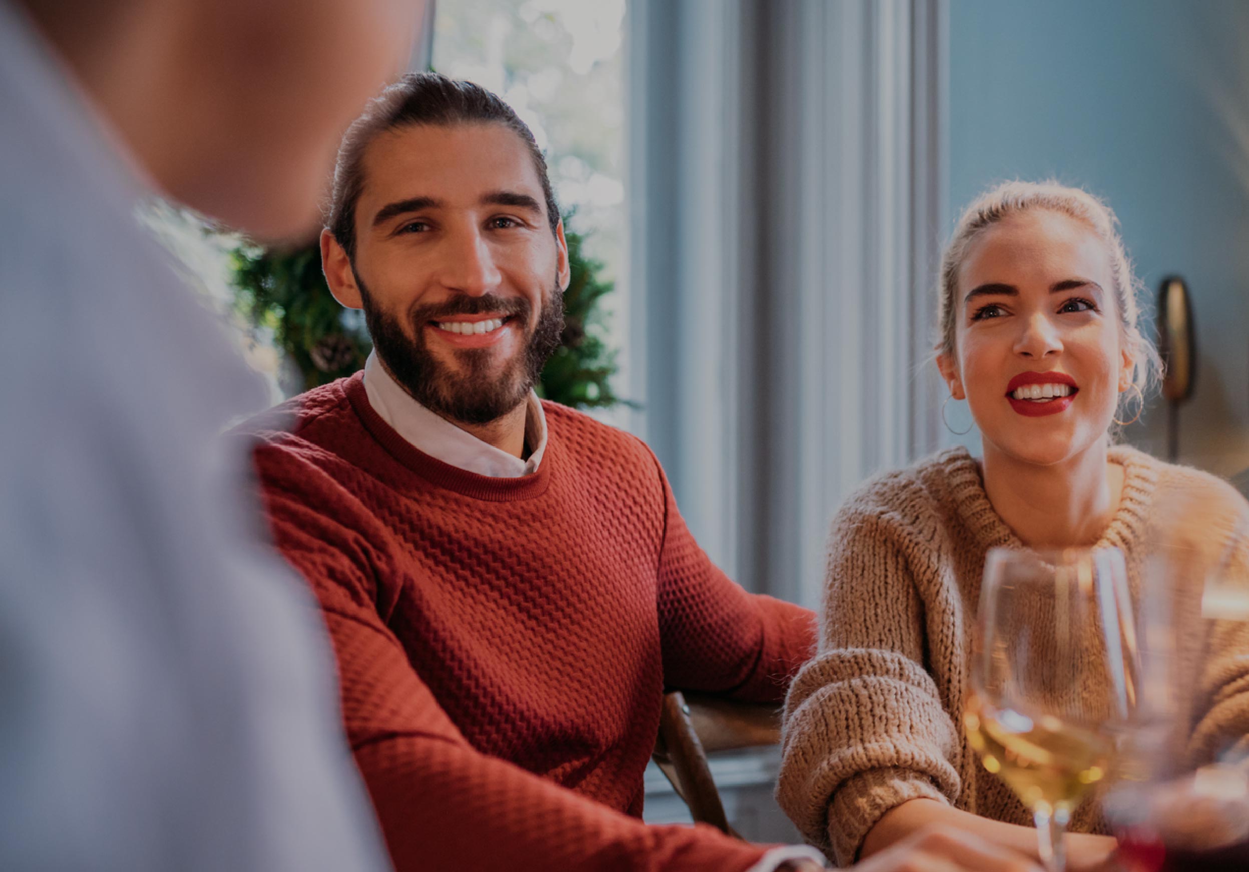 Couple at a dinner table meeting the parents for the first time