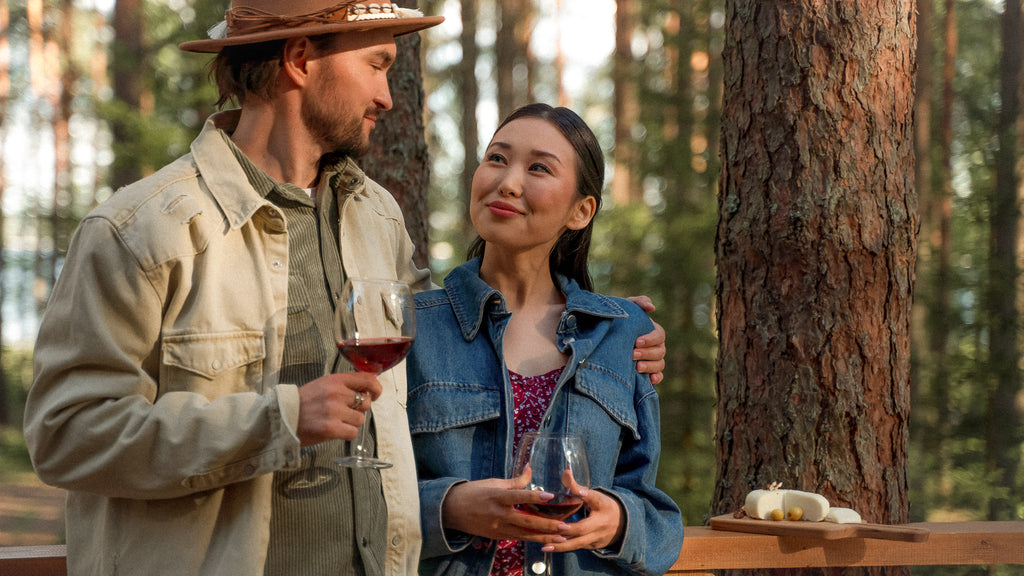 Couple drinking pinot noir wine while enjoying the outdoors