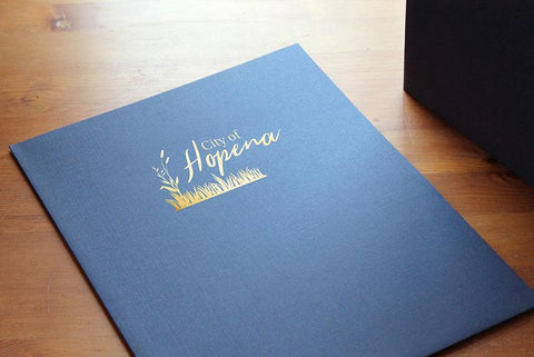 Low minimum pocket folders with company logo on front cover