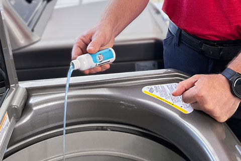 A man using Lifeproof Home 4-in-1 Washer product in a washing machine