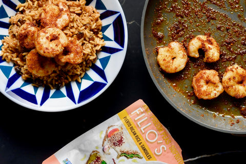 Shrimp seasoned with MÁGICO and a bed of FILLO'S Puerto Rican  Rice and Gandules.