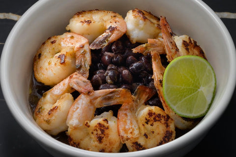 Bowl of Fillo's Cuban Sofrito Beans topped with Shrimp crusted with MÁGICO Sofrito Spice