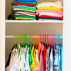 kids clothing hanging in a wardrobe