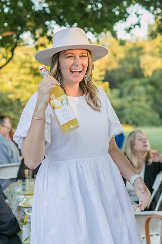 bride to be wearing ivory hat personalized