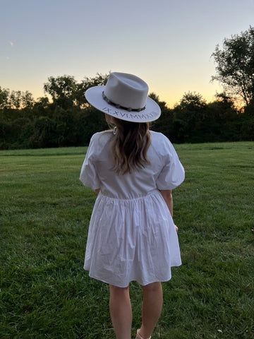 bride to be with personalized hat in ivory roman numeral customization