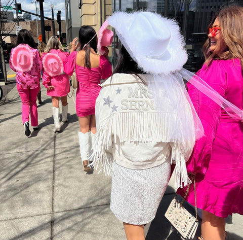 bride wearing white fringe jacket at Nashville Bachelorette