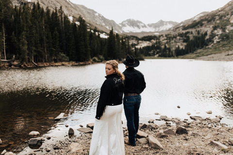 Vow renewal wearing black fringe bride jacket with nickname on the back