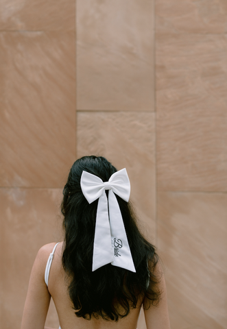 personalized hair bow worn by bride on her wedding day