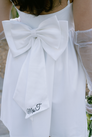 long bow on bride's engagement shoot dress