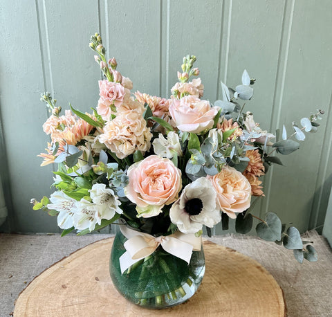 peach and white flowers in vase