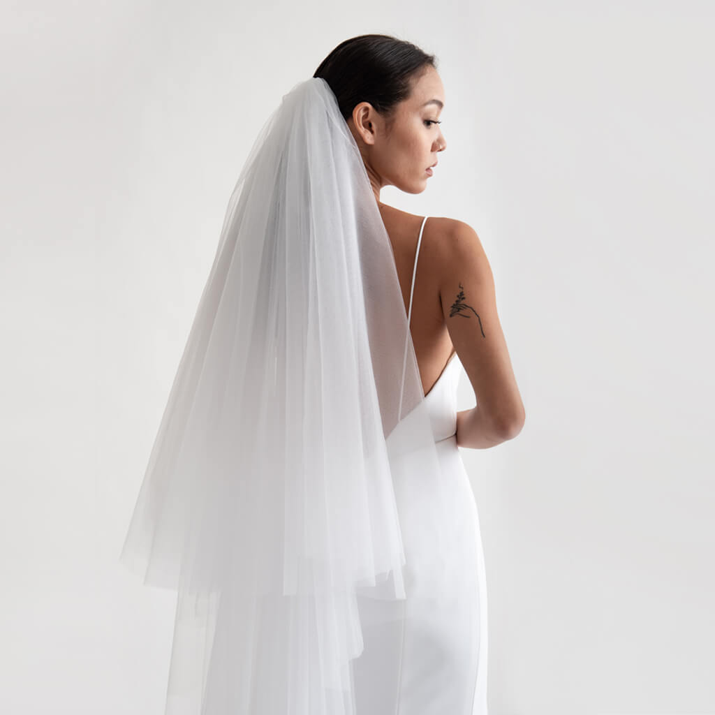 A model wearing a Christina Devine wedding veil