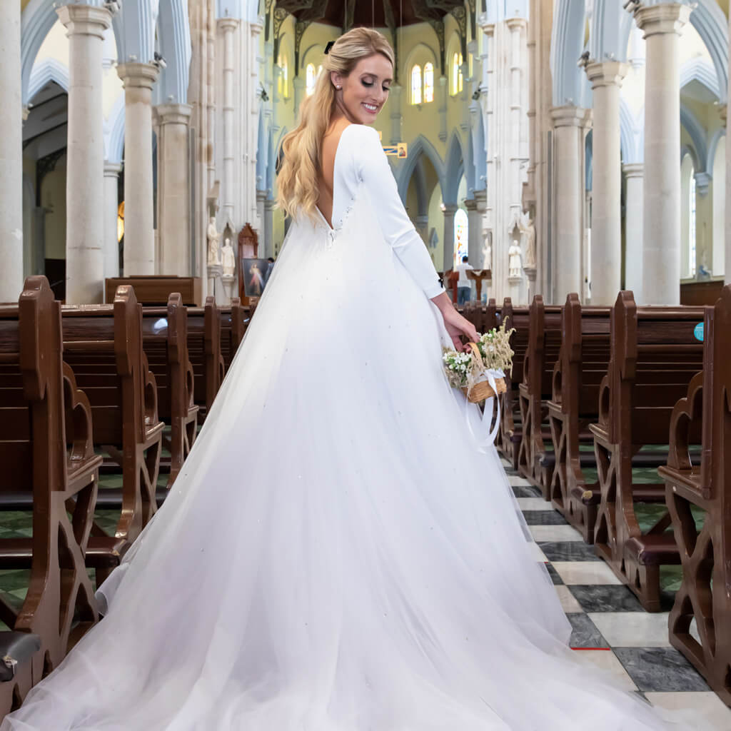 A bride wearing Christina Devine wedding dress