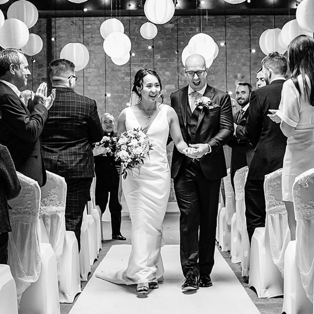 Christina Devine bride and groom walking down the aisle