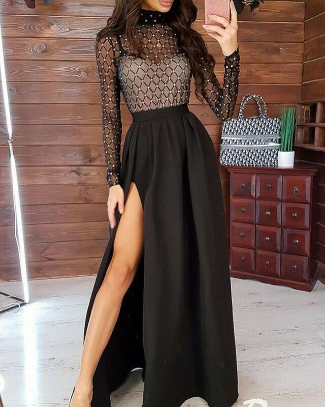 Woman in long black dress long sleeves summer fashion