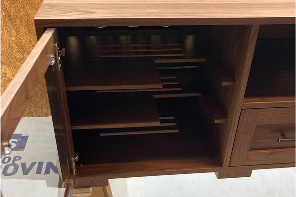 custom walnut media console with special shelves to accomodate a gaming console vertically